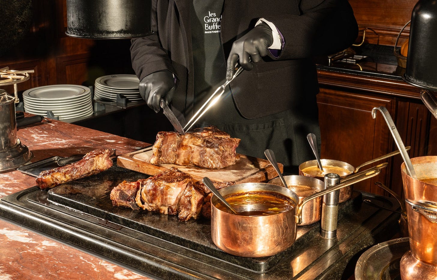 Image may contain Clothing Glove Adult Person Blade Knife Weapon Cup Bread Food Meat and Pork
