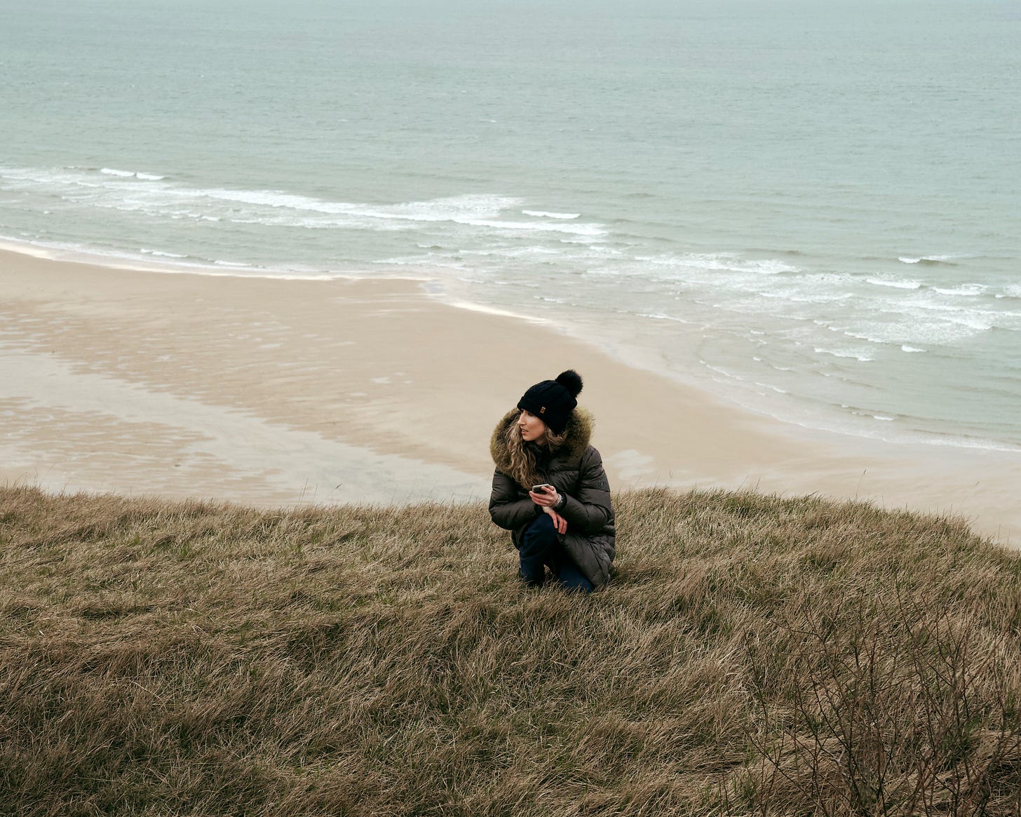 Charlotte Verminck scouting the cliff scene on a cliff in Cap Blanc Nez France