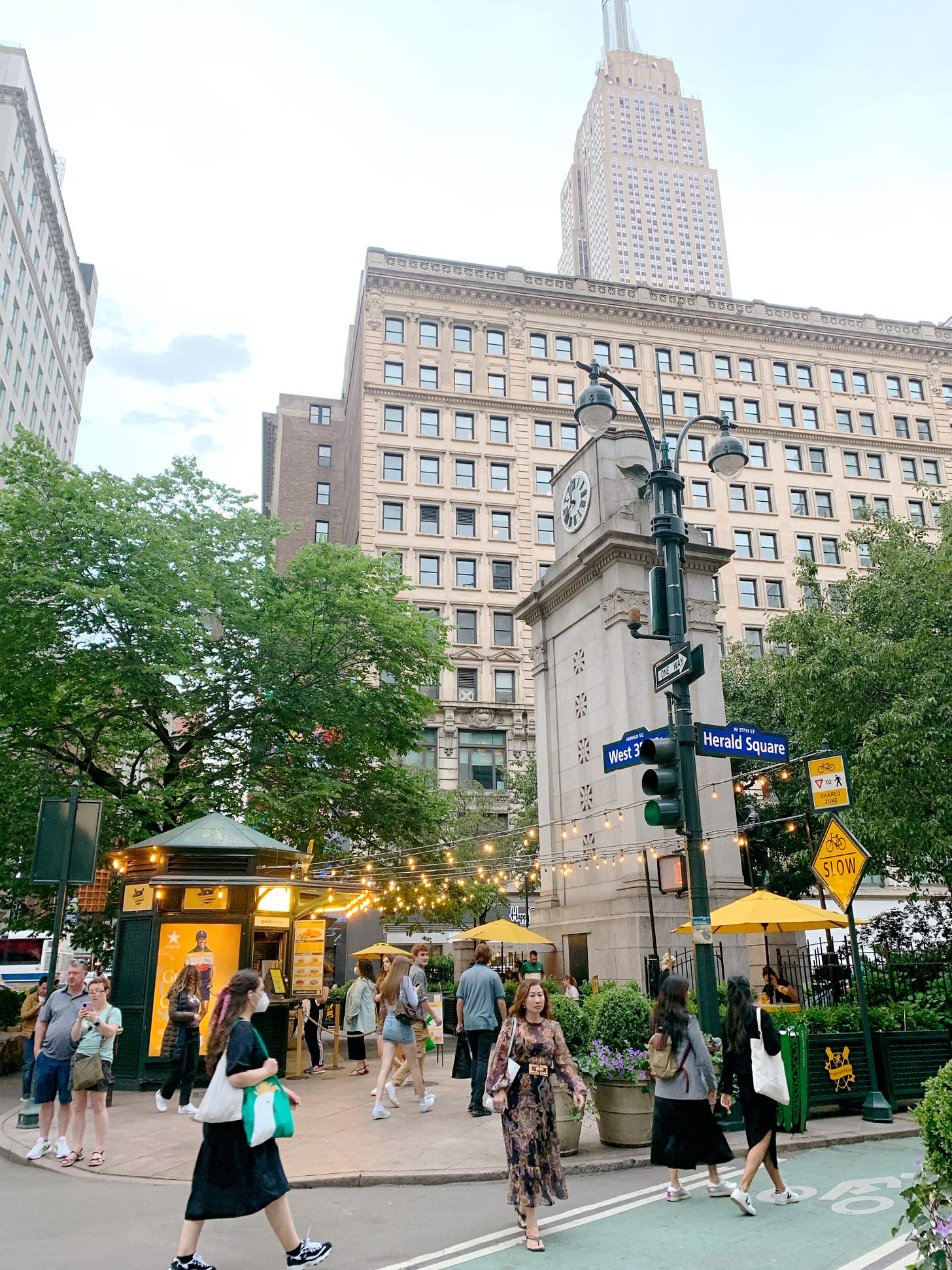 People walking around Herald Square in New York