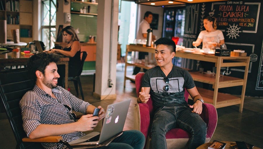 Coworking space with two men talking