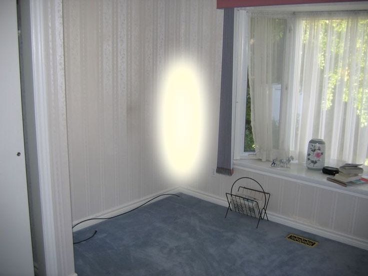 This may contain: an empty room with a window and a chair in the foreground, sunlight coming through the window This may contain: an empty room with a window and a chair in the foreground, sunlight coming through the window