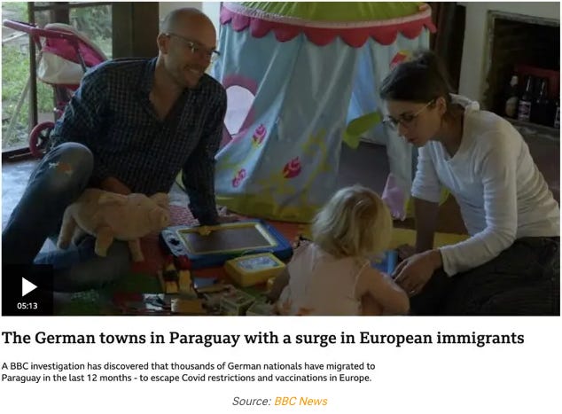 A person and person sitting on the floor with a child

Description automatically generated