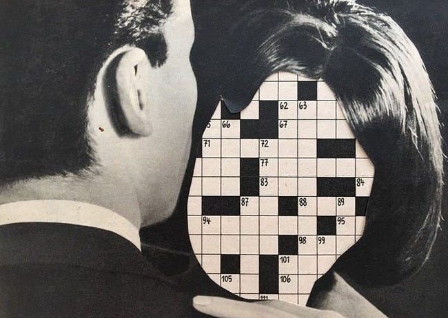 This may contain: a man and woman looking at a crossword puzzle in the shape of a head