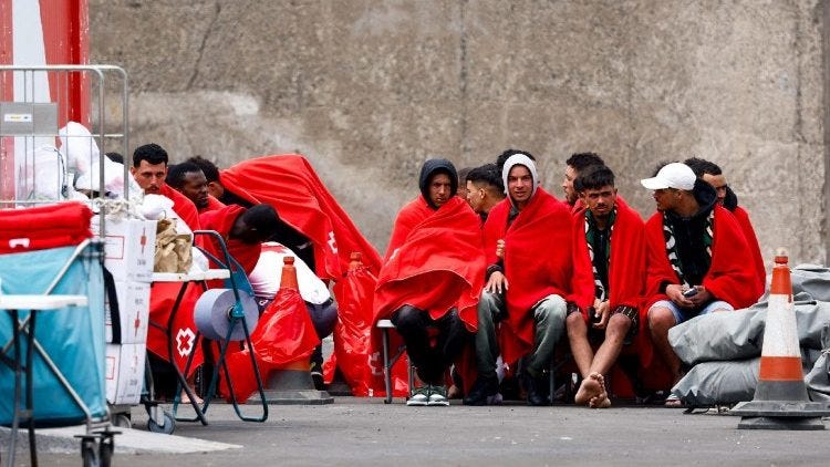 Migrants wait for assistance at the port of Arguineguín in 2020 Migrants wait for assistance at the port of Arguineguín in 2020