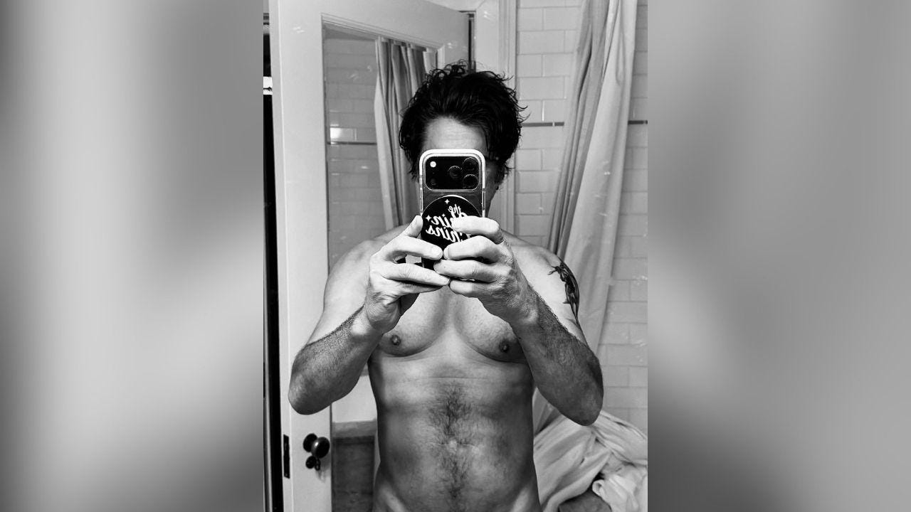 image of John Stamos celebrated his 63rd birthday by sharing a black-and-white shirtless selfie on Instagram. image of John Stamos celebrated his 63rd birthday by sharing a black-and-white shirtless selfie on Instagram.