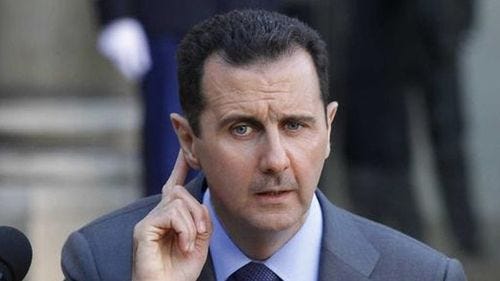 Bashar al-Assad from the Assad Must Go meme template.