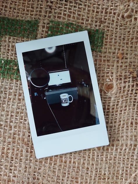 Instant photographs of coffee mugs.