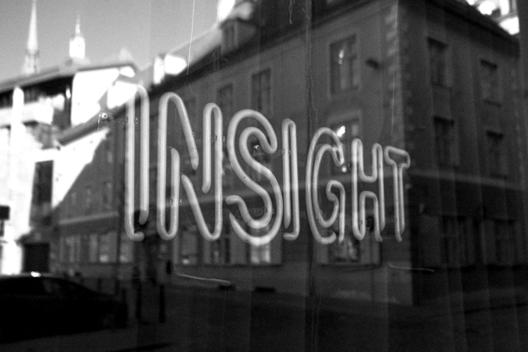 a window that has a reflection of a building in it a window that has a reflection of a building in it