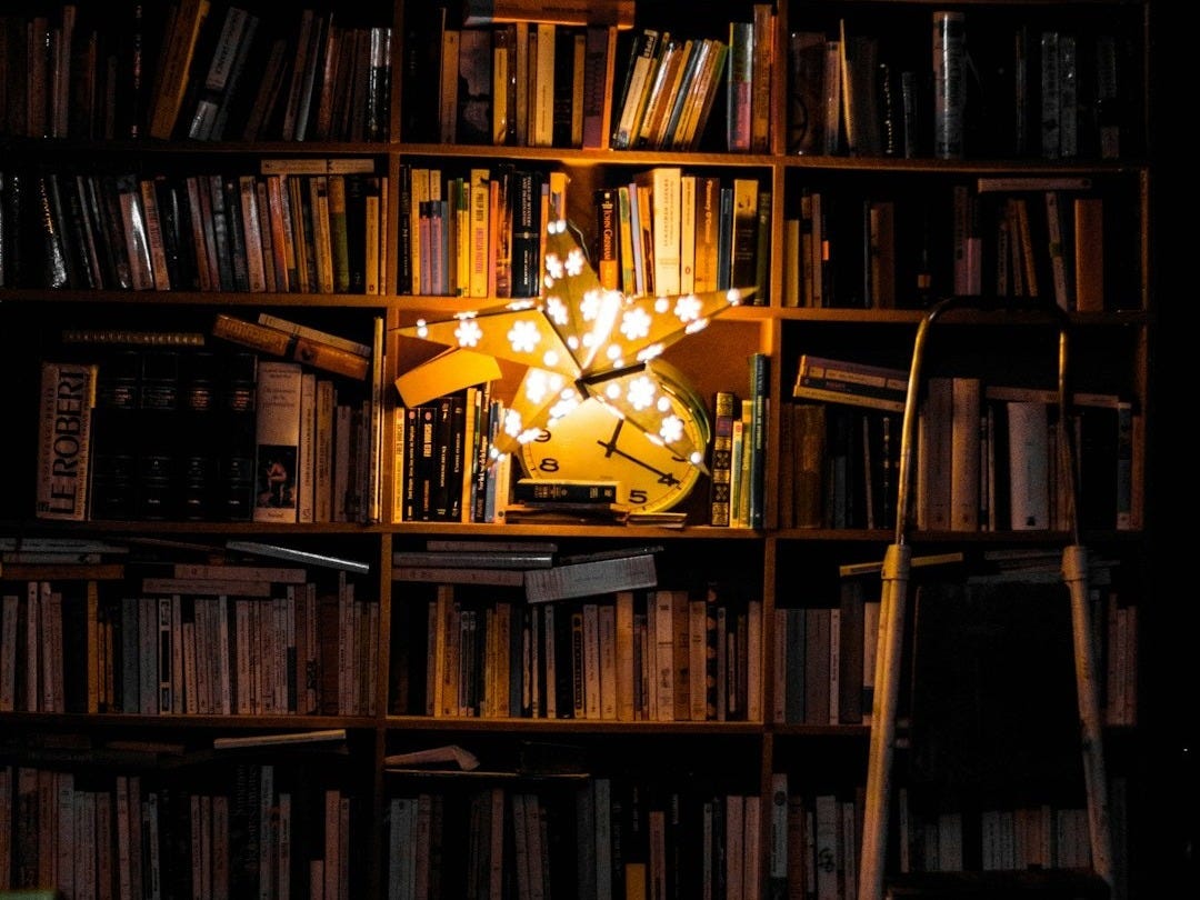 photography of bookshelf and star LED light decor