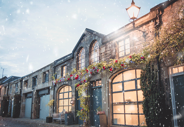 The Nile office - a small mews building in Edinburgh - illuminated with warm light in ananimated snowshower The Nile office - a small mews building in Edinburgh - illuminated with warm light in ananimated snowshower