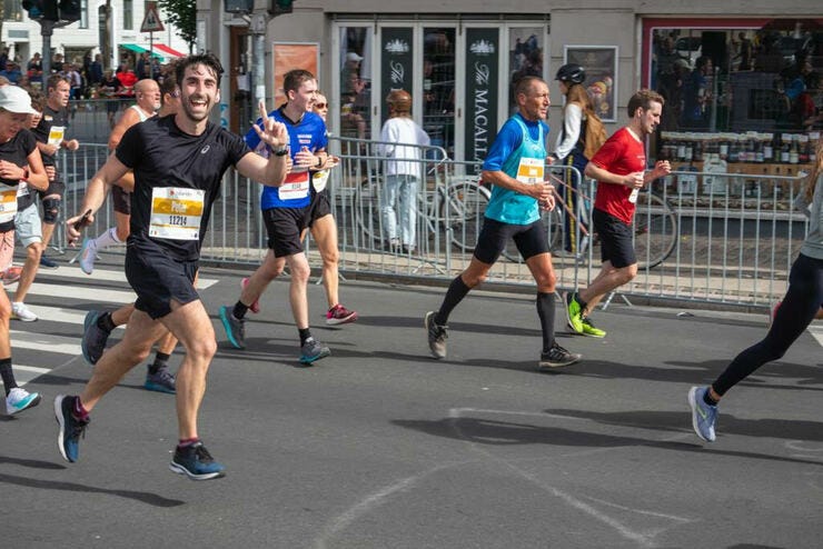 Smiling and hopping along to my cheesy EDM playlist 🎶 (Photo Credit: Ralf)