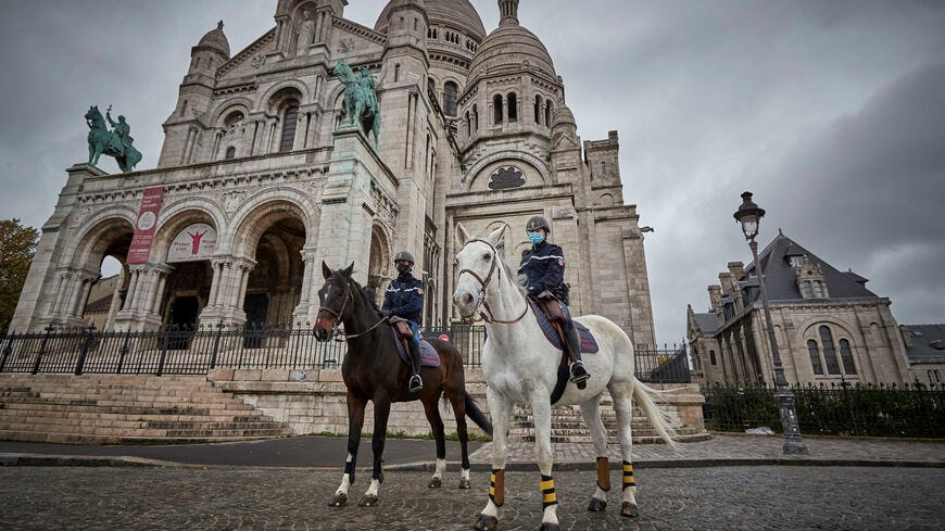 Mounted Police patrol in front of Sacré Cœur Basilica in Montmartre, Paris.