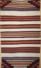 A close up of a rug

AI-generated content may be incorrect.