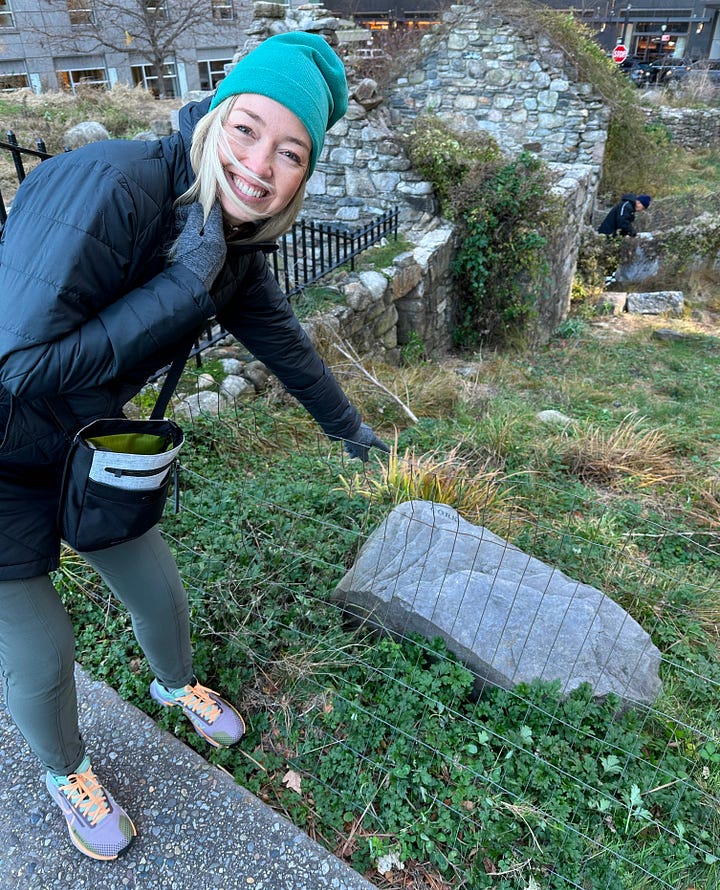 Author and her dad, author pointing at a rock