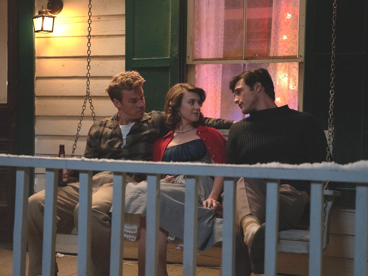 Still from On Swift Horses features Will Poulter, Daisy Edgar-Jones, and Jacob Elordi sitting on a porch swing at night. Still from On Swift Horses features Will Poulter, Daisy Edgar-Jones, and Jacob Elordi sitting on a porch swing at night.
