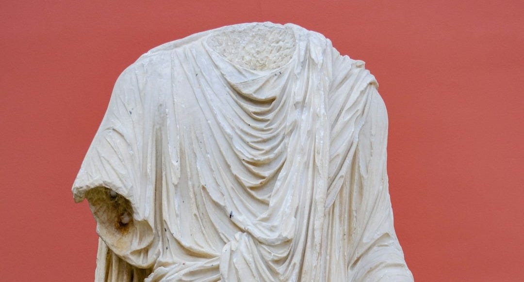 a statue of a woman with a veil on her head