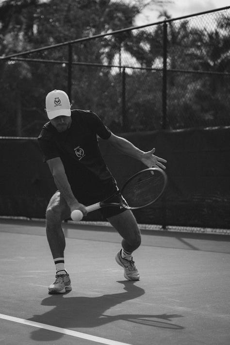Black and white collage of five tennis scenes: two women in club hats sitting on a bench, two male players stringing rackets on the grass, and three dynamic in-game shots capturing movement and focus. All wearing Miami Racket Club apparel.