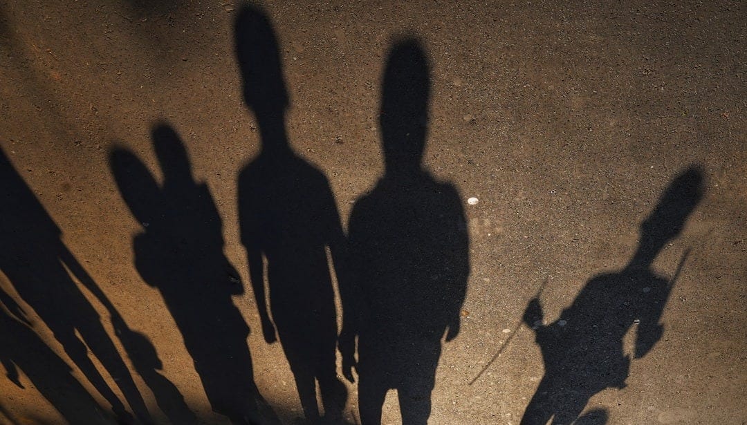 a group of people standing next to each other