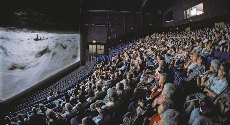 This may contain: an audience is watching a movie on the screen