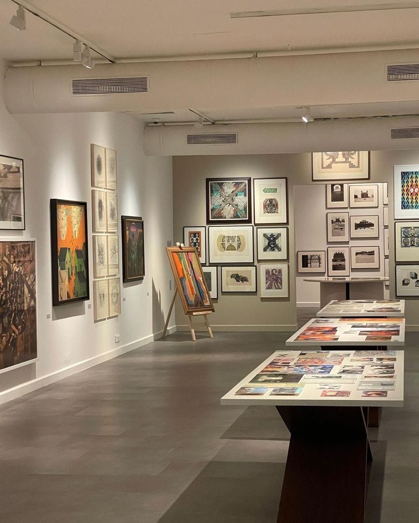 an art gallery filled with lots of paintings