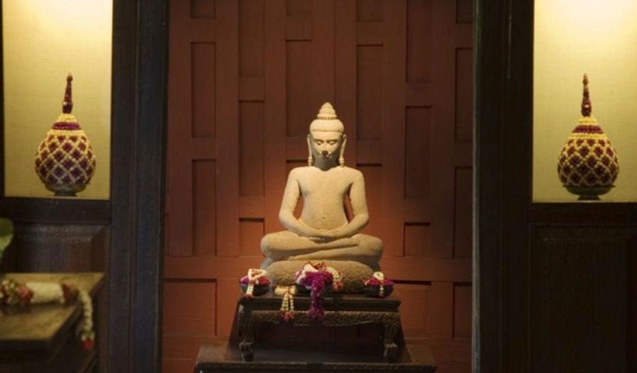 A thousand year old Buddha from Myanmar resting inside the Jim Thompson House.