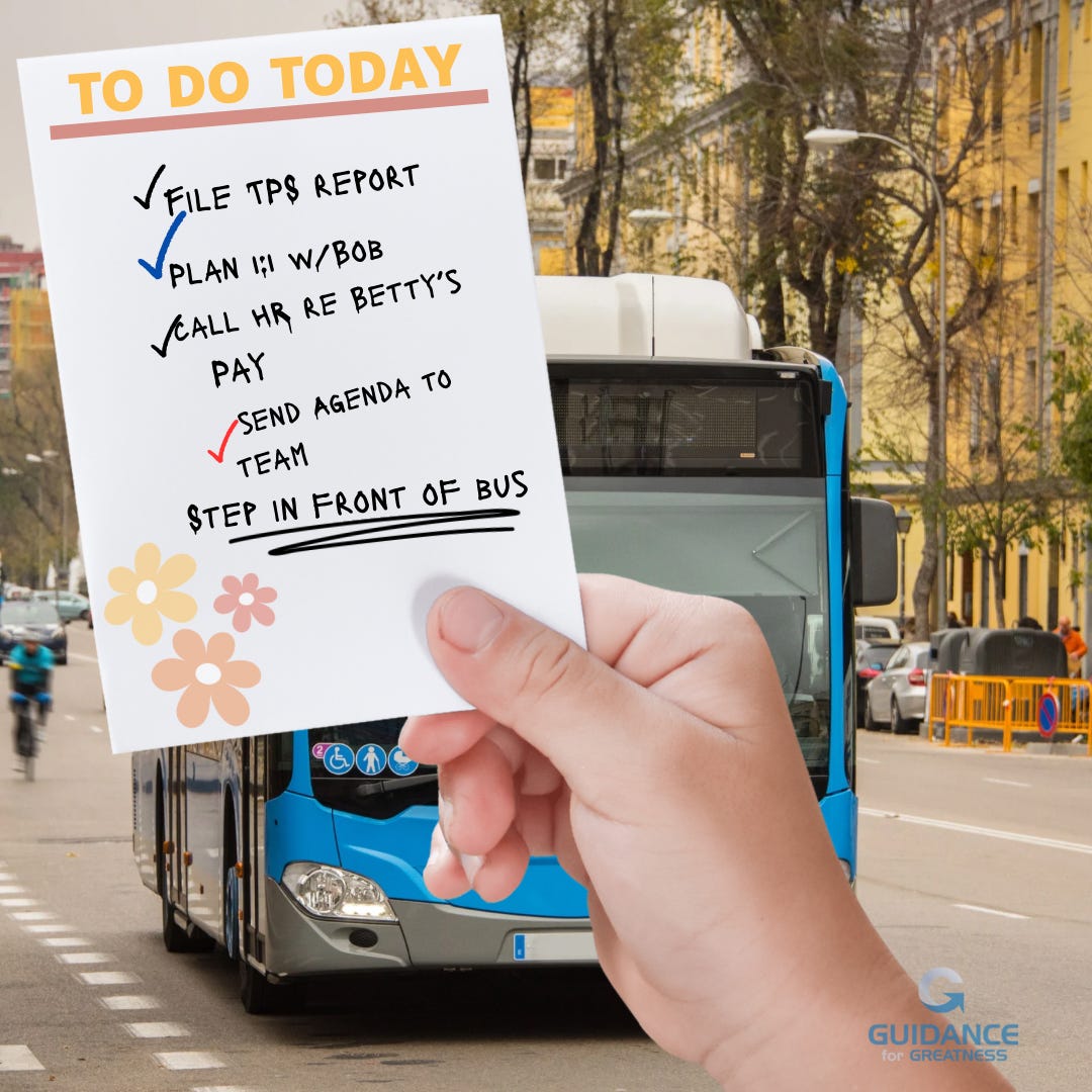 A hand holds a handwritten to-do list against the backdrop of a city street with a blue and white public bus moving toward the viewer. The list, titled “TO DO TODAY” in orange lettering, contains several checked-off items including “FILE TPS REPORT,” “PLAN 1:1 W/BOB,” “CALL HR RE BETTY’S PAY,” and “SEND AGENDA TO TEAM.” The final item, “STEP IN FRONT OF BUS,” is underlined multiple times for emphasis. Decorative flower stickers in orange and pink adorn the bottom left corner of the note. The urban setting shows autumn trees, parked cars, and construction barriers along the street.​​​​​​​​​​​​​​​​