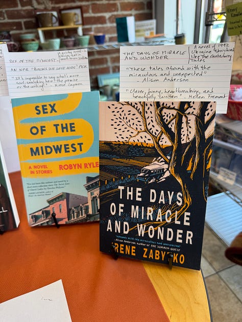 Images of Galiot Press books displayed on a table inside a café