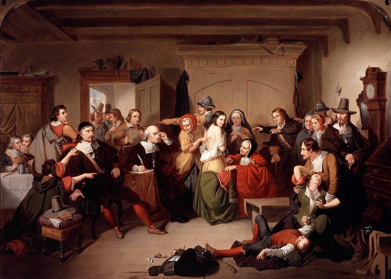 Puritans examining a woman for a witch's mark Puritans examining a woman for a witch's mark