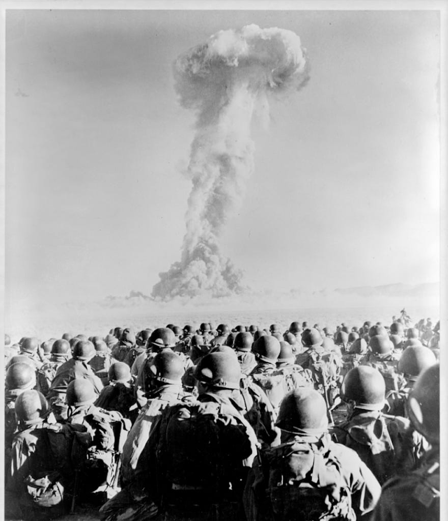 Members of the 11th Airborne Division kneel and watch a mushroom cloud stemming from an atomic bomb test at Frenchman’s Flat, Nevada Test Site, in November 1951. (Photo: Library of Congress) Members of the 11th Airborne Division kneel and watch a mushroom cloud stemming from an atomic bomb test at Frenchman’s Flat, Nevada Test Site, in November 1951. (Photo: Library of Congress)