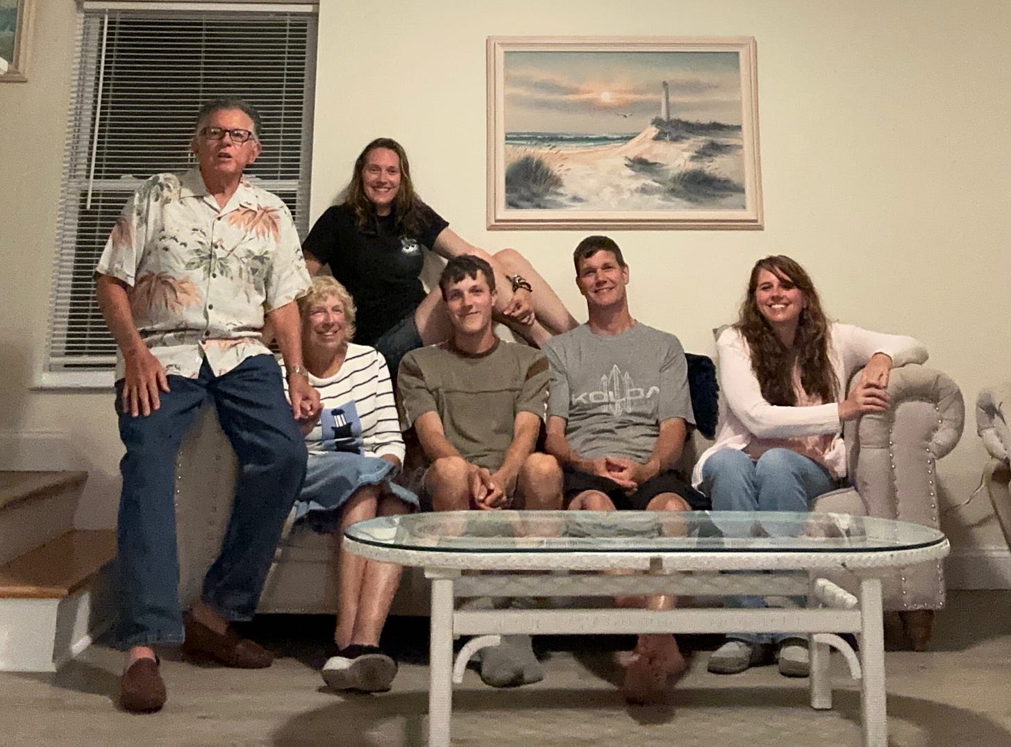 Photo of my parents, sister, nephew, brother-in-law and me on the couch in our rental place.