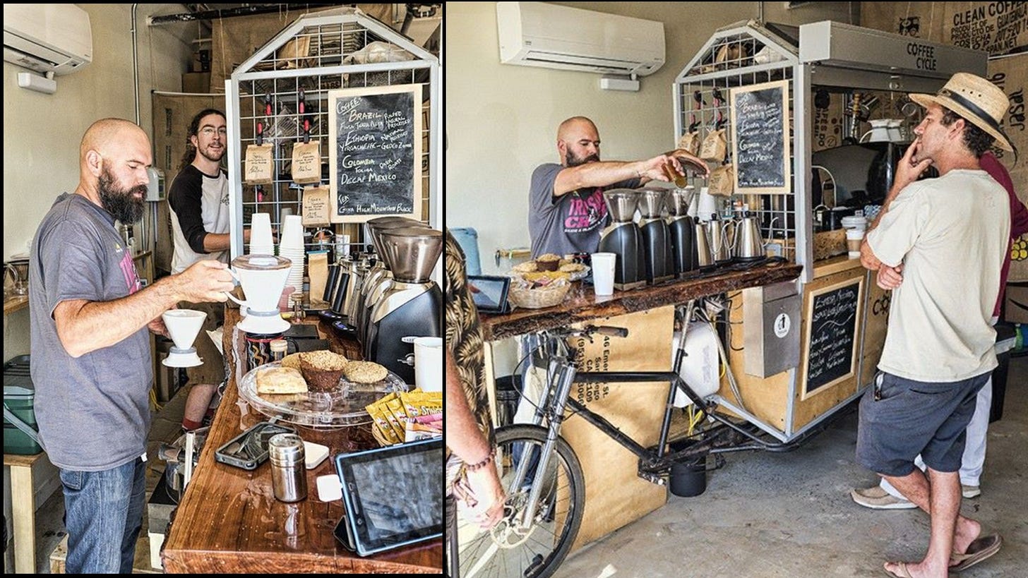 Left: A bald, bearded man sets a coffee pourover device on a coffee mug standing behind a coffee bar covered in pastries and grinders. Another barista smiles in the background. Right: The barista pours beans into a coffee grinder while customers look on.