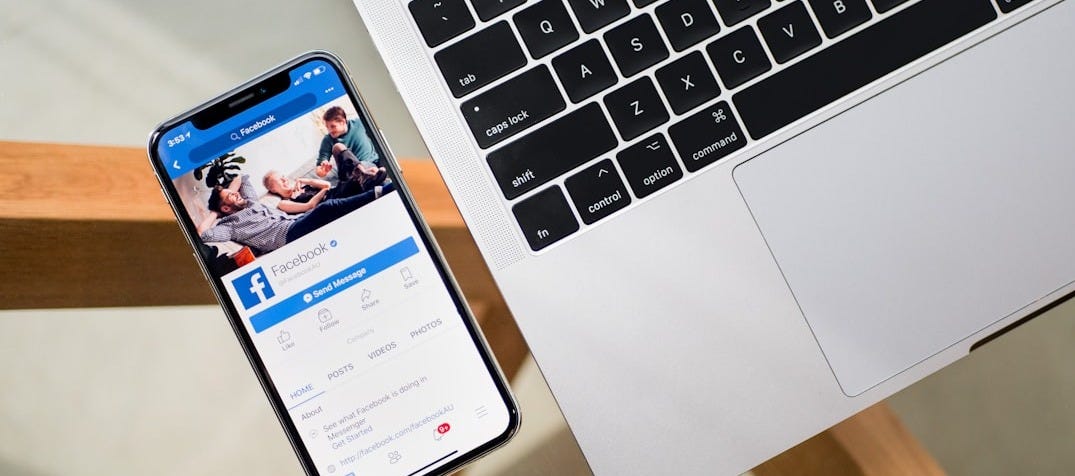 iPhone X beside MacBook iPhone X beside MacBook