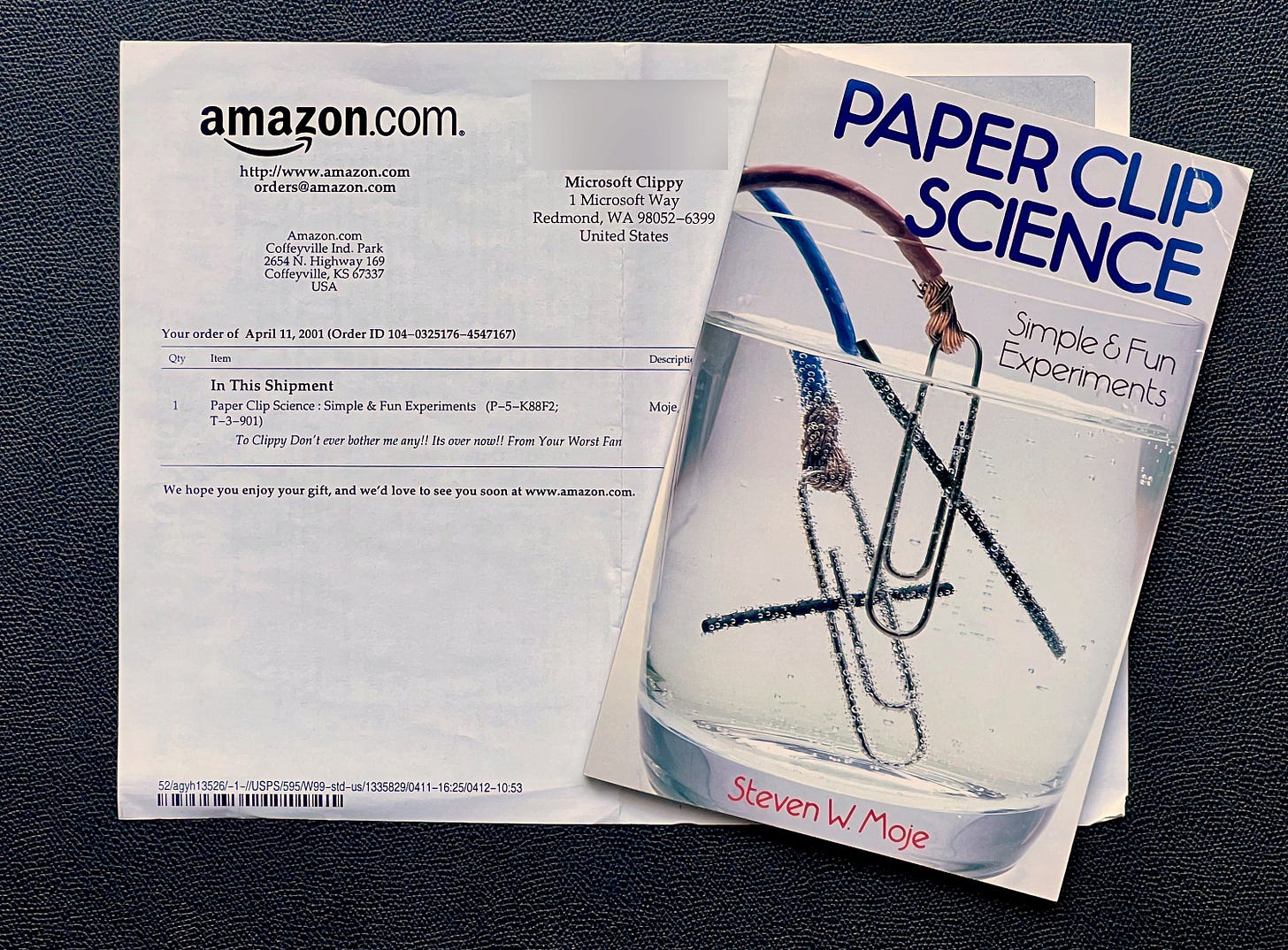 Book "paperclip science" and a receipt from amazon with a message "don't ever bother me" Book "paperclip science" and a receipt from amazon with a message "don't ever bother me"
