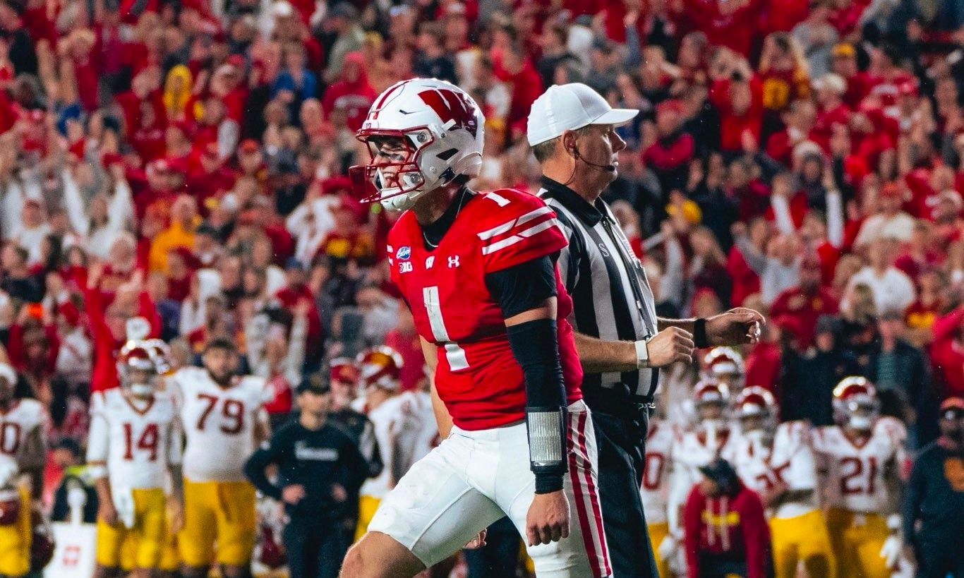 Wisconsin quarterback Colton Joseph celebrates on the field during the Badgers' win over USC, with fans cheering in the background. Wisconsin quarterback Colton Joseph celebrates on the field during the Badgers' win over USC, with fans cheering in the background.