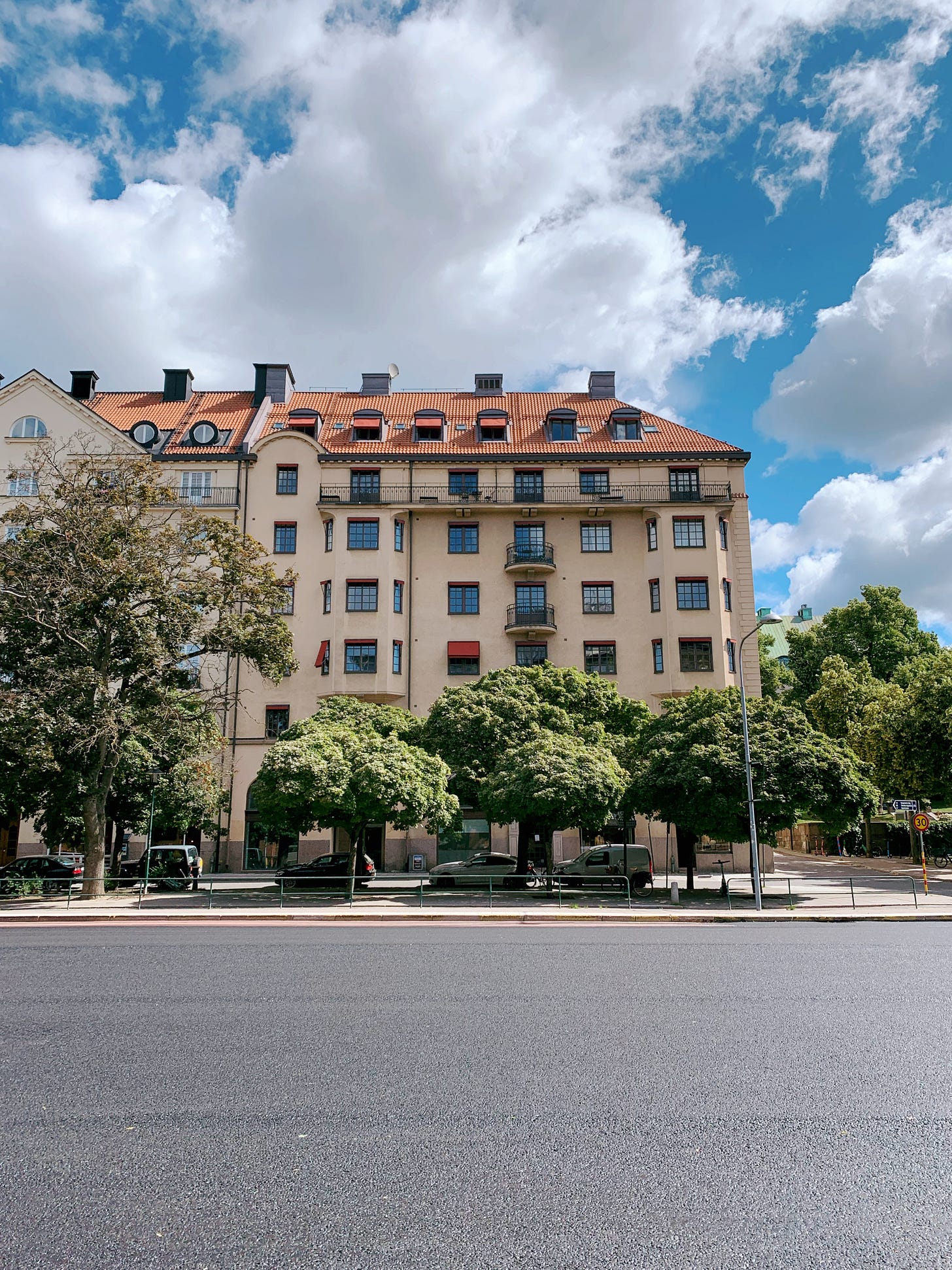 Looking at a tree-lined street across the road