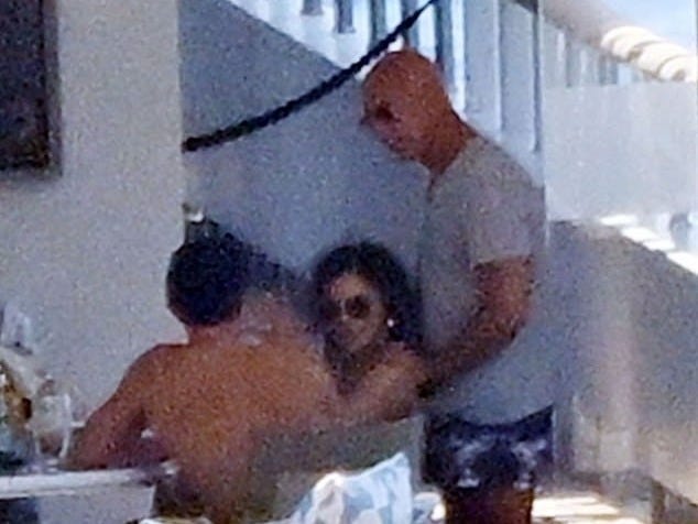 Orlando is seen with newlyweds Sanchez and Bezos