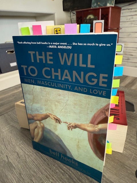 Paperbook standing upright with colorful reading flags around edges.