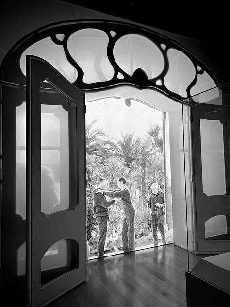 woman looking at a Picasso landscape, "The Village of Vauvenargues." Photograph of Picasso in his studio, and a display showing (R-L) Pablo Picasso, Luis Miguel Dominguin and Paulo Picasso