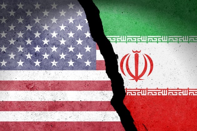Flag of USA and Iran painted on a concrete wall Flag of USA and Iran painted on a concrete wall