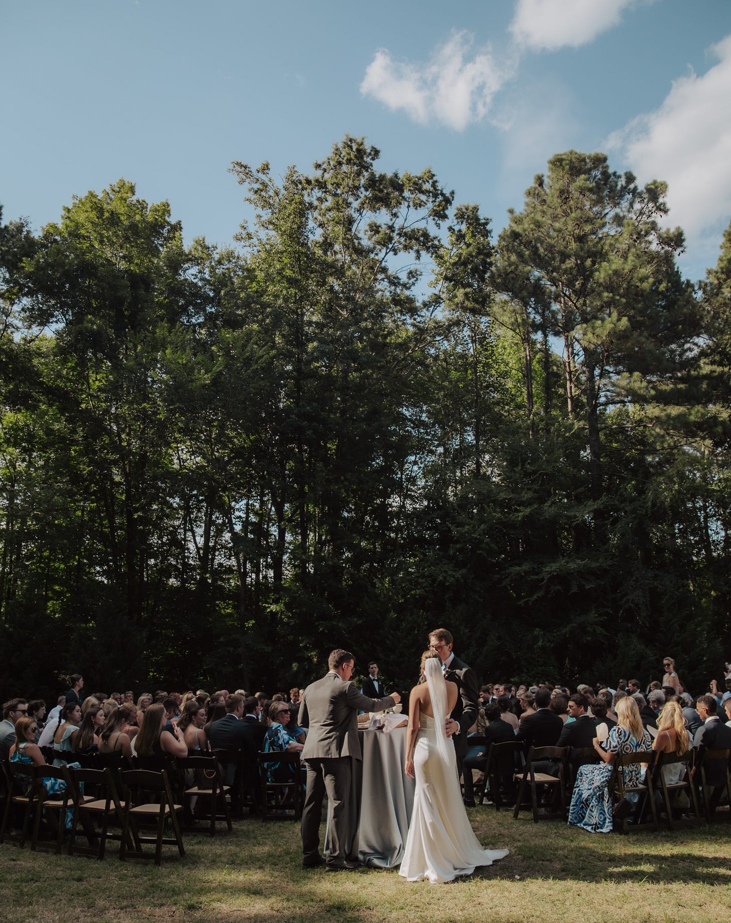husband and wife at a wedding taking communion