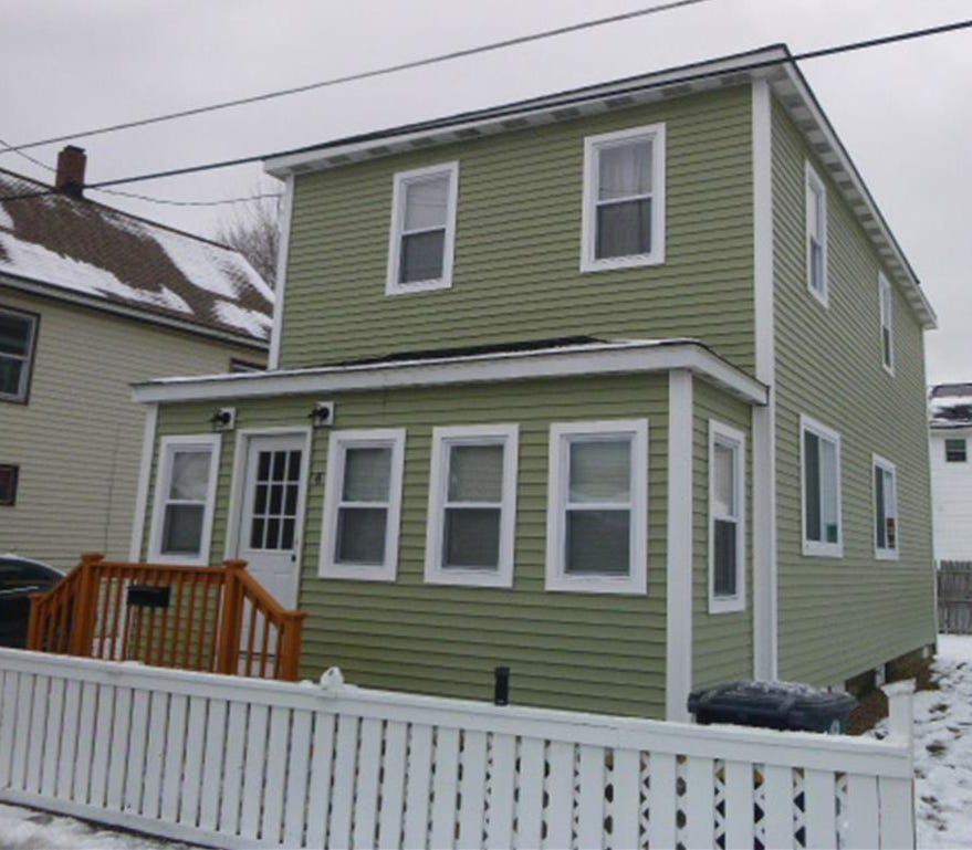 A box of a house where James Roche and his family used to live. It has a roof that gently slopes to the rear as opposed to the traditional peaked roof. The house has been modernized with vinyl siding and windows. A box of a house where James Roche and his family used to live. It has a roof that gently slopes to the rear as opposed to the traditional peaked roof. The house has been modernized with vinyl siding and windows.