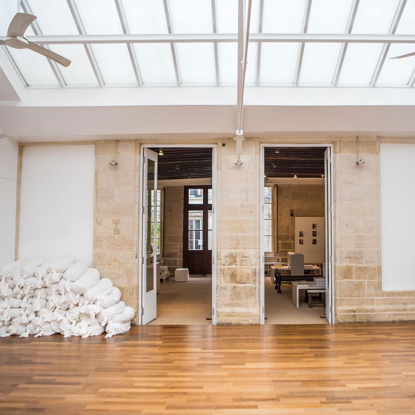 Main yoga practice space under the atrium at Rasa Yoga in Paris, France