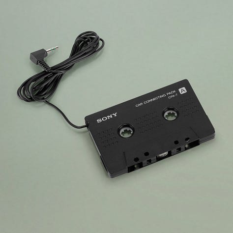 Photos of the Ryuichi Sakamoto "Smochy" compact disc, a Sony Discman D-2, and Sony CPA-7.