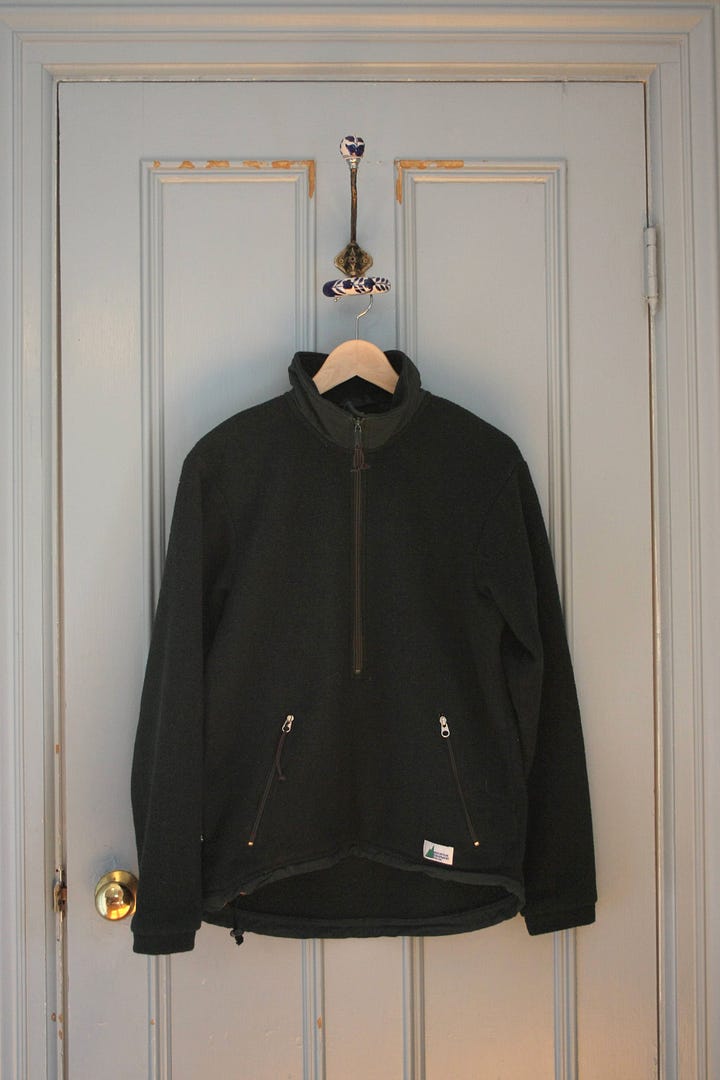 Two items, a plaid shirt and a green fleece