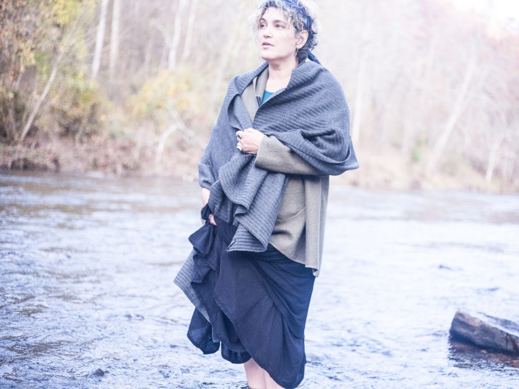 Maia standing in a riverbed