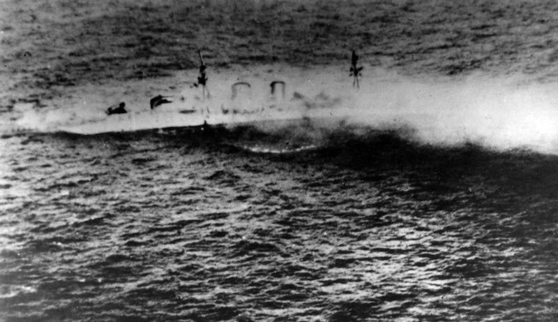 Another black and white photo captured of Exter sinking beneath the waves of the Java Sea. The photo was taken by the Imperial Japanese Navy. Another black and white photo captured of Exter sinking beneath the waves of the Java Sea. The photo was taken by the Imperial Japanese Navy.