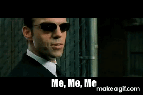 a man in a suit and tie is wearing sunglasses and saying `` me , me , me `` .