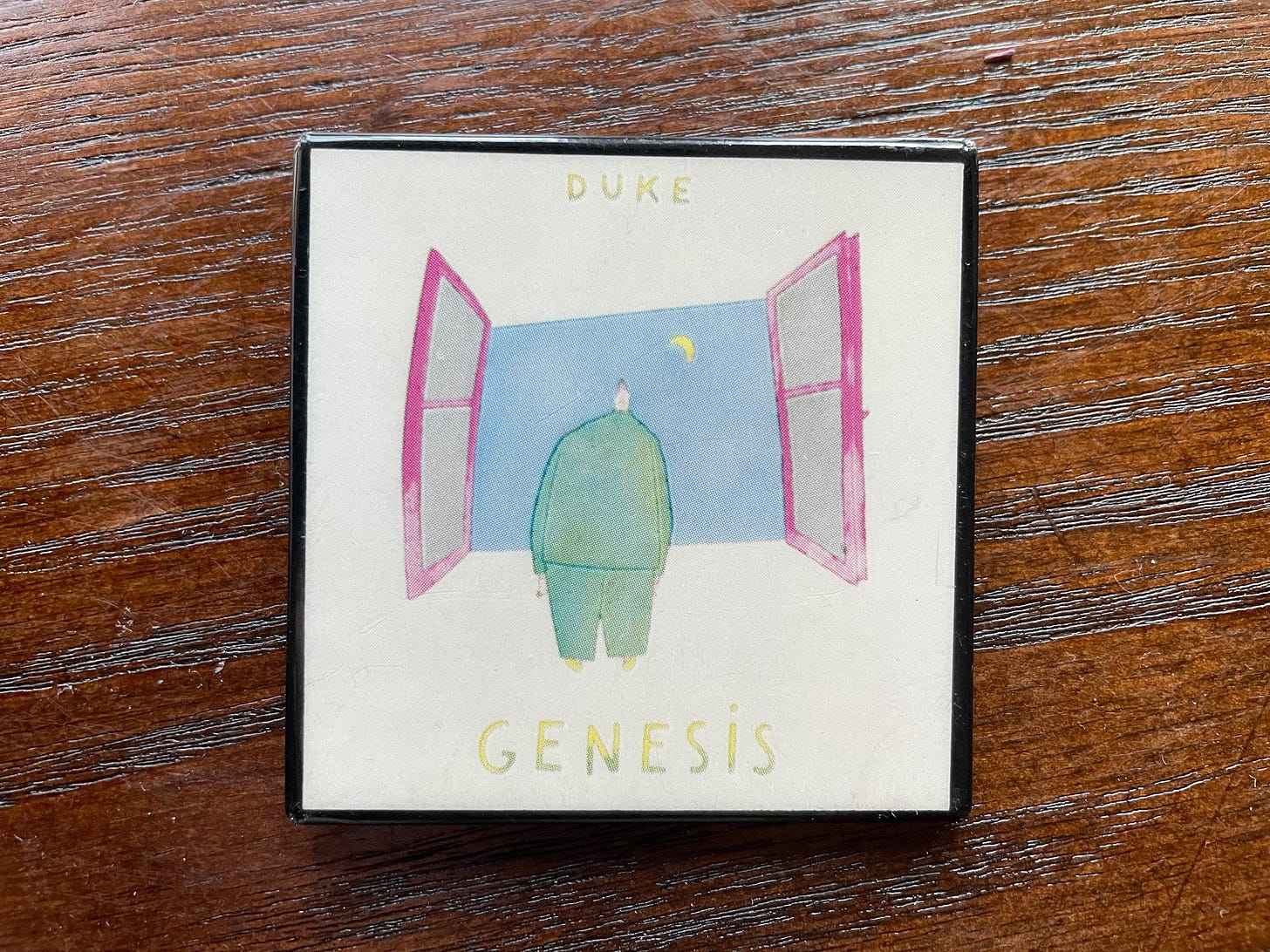 Genesis pin featuring the cover of their 1980 album Duke Genesis pin featuring the cover of their 1980 album Duke