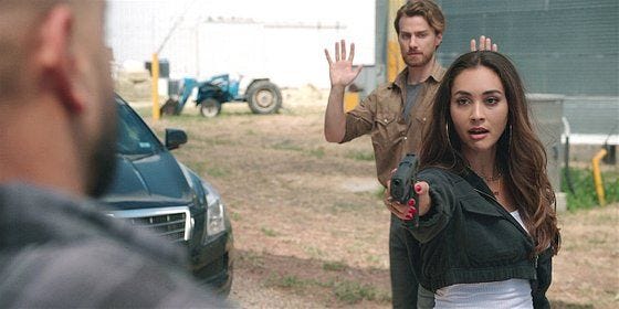 Walker Micki with gun on Serano and Garrision behind her. Walker Micki with gun on Serano and Garrision behind her.