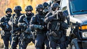 Catholic anti-abortion activist arrested at home by SWAT team in front of  children, wife says | Washington Examiner